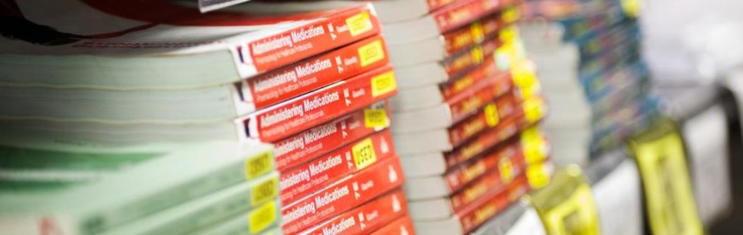 Photo of textbooks on shelf.